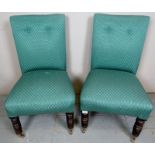 A pair late Victorian chairs upholstered