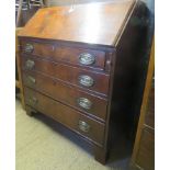 A Georgian mahogany bureau with a fitted