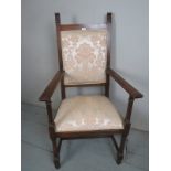 A C.1900 mahogany throne chair upholster