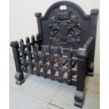 A small wrought iron fire basket with li