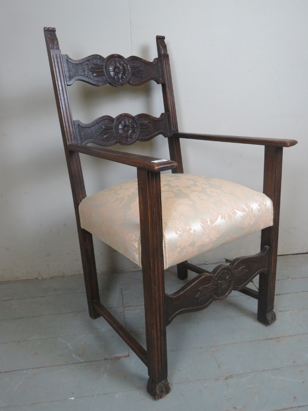 A C.1900 oak throne chair with a carved