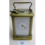 A brass carriage clock, with key est: £3