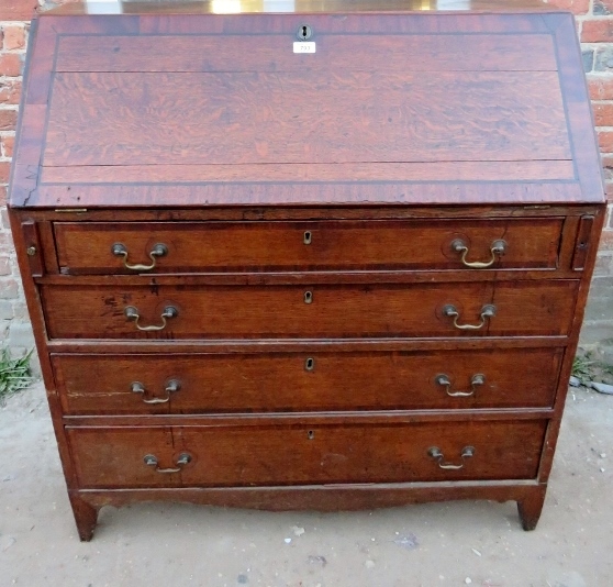 A 19th Century oak bureau with a fall fr