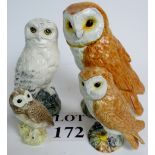 Four Beswick models of owls, heights ran