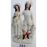 A 19th century Staffordshire Pottery flat back figure group depicting male and female companion,