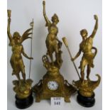 A large and ornate French gilt metal three piece clock garniture,