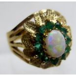 A 9ct gold opal and emerald ring, size L.