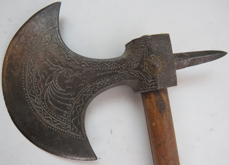 An old Tribal axe, probably c1900, having an engraved steel head and hardwood shaft, 78cm long. - Image 2 of 2