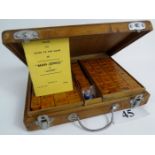 A vintage Mah Jong set in Chinese carved wooden case est: £50-£80