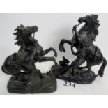 A matched pair of 19th century bronzed cast metal models of Marley horses, 27cm and 23cm high.