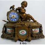 A good 19th century ormolu and sevres porcelain mantel clock, cast with a girl,