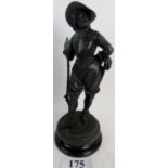 A vintage bronzed cast metal sculpture modelled as a Cavalier soldier, on ebonised base, 47cm high.