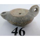 An ancient Roman pottery oil lamp, probably 1st/2nd century AD,