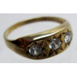 A 9ct gold ring inset with 3 white stones,