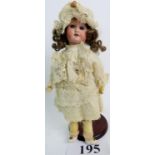 An early 20th century Armand Marseille bisque head doll, various marks to back of head,