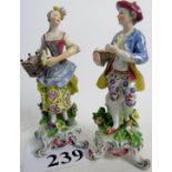 A pair of 18th/19th century porcelain figures in the style of Chelsea,