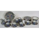 Porcelain part tea service, decorated with a floral pattern with gilt edging,