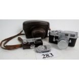 A c1960's Leica M3 camera, light meter, view finder, lense,