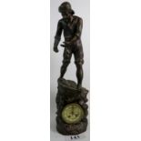 A large decorative figurative bronzed metal mantel clock, modelled as a Sailor and boat above waves,