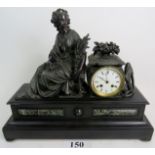 A decorative 19th century cast metal and marble cased mantel clock, with classical maiden surmount,
