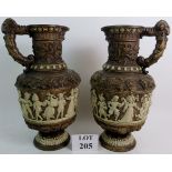 A pair of late 19th/early 20th century Germanic ceramic ewers,