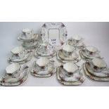 A 1920's/30's Shelley Art Deco 34 piece part tea set in the Queen Anne shape and the 'Peaches &