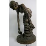 A large bronzed sculpture cast as a semi-naked classical maiden collecting water,