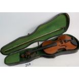 A 19th/early 20th century violin with spurious "STRADIVARIUS" label, 35cm, with bow and case (a/f).