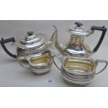 A 4 piece silver tea service comprising teapot, hot water, sugar and cream jug,