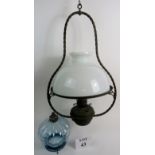 A late 19th/ early 20th century hanging oil light with opaque glass shade,