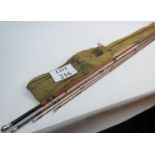 A vintage Hardy four piece split cane Fishing Rod and canvas cover.