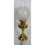 Brass oil lamp with frosted glass shade,