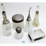 A collection of 5 silver topped scent bottles,