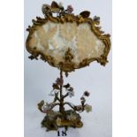 An ornate 19th century gilt-metal and porcelain table lamp in the Rococo-style,