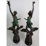 A pair of vintage French patinated and bronzed spelter figures cast as classical Gods on Eagles,