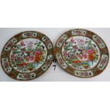 A pair of 19th century Chinese Famille-rose porcelain cabinet plates, painted with busy figurative,