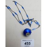 A vintage ladies blue enamelled ball shaped watch on a fine silver and enamelled chain est: