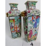 A pair of 19th century Chinese Famille-rose porcelain vases, with twin gilt mask handles,