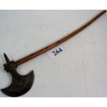 An old Tribal axe, probably c1900, having an engraved steel head and hardwood shaft, 78cm long.
