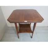 An Edwardian inlaid lamp table in good c