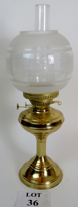 Brass oil lamp with frosted glass shade,