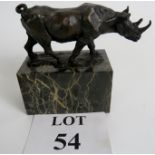 A contemporary bronze statue of a rhino on a figured marble plinth, 6" wide,