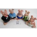 A set of five Wade Nat West money banks depicting a pig family in human clothes,