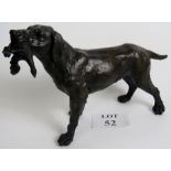 A contemporary bronze statue of a gun dog holding game, 17" long,