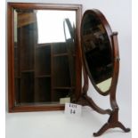 A late 19th/early 20th century mahogany framed oval swing vanity mirror,