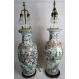 A pair of large Chinese vases converted to electric lamps, famille verte, with fitted stands,