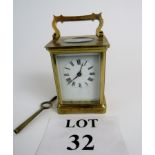 19th century brass carriage clock made by R & Co Paris, key present,