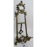An ornate cast gilt-metal easel stand, 54cm high,