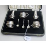 A five piece silver condiment set compri