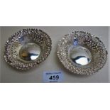 A pair of silver circular bonbon dishes
